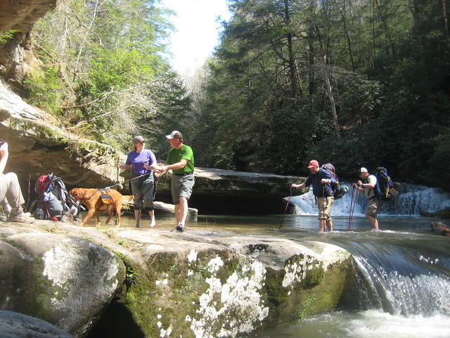 Teamwork crossing Bark Creek Falls
